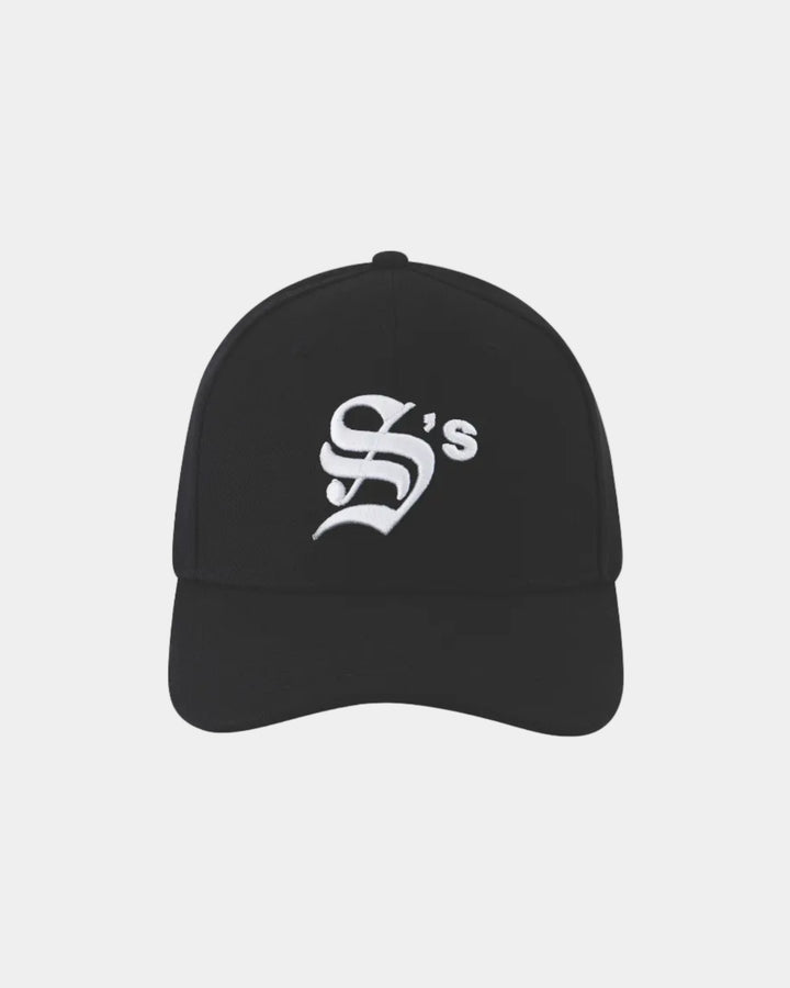 Black cap with a white logo on a grey background