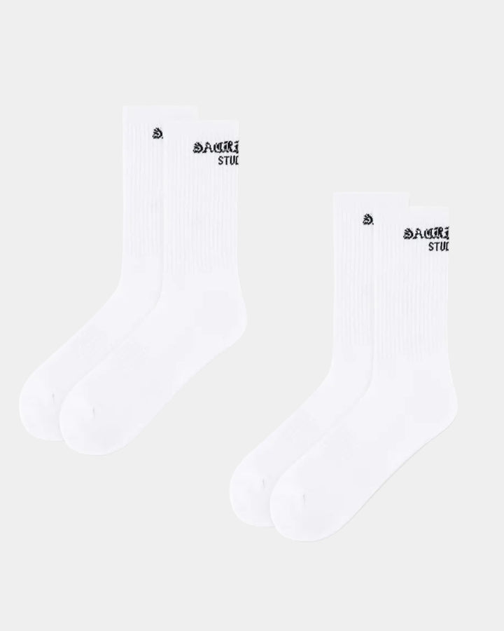 Two white socks with black branding on a white background