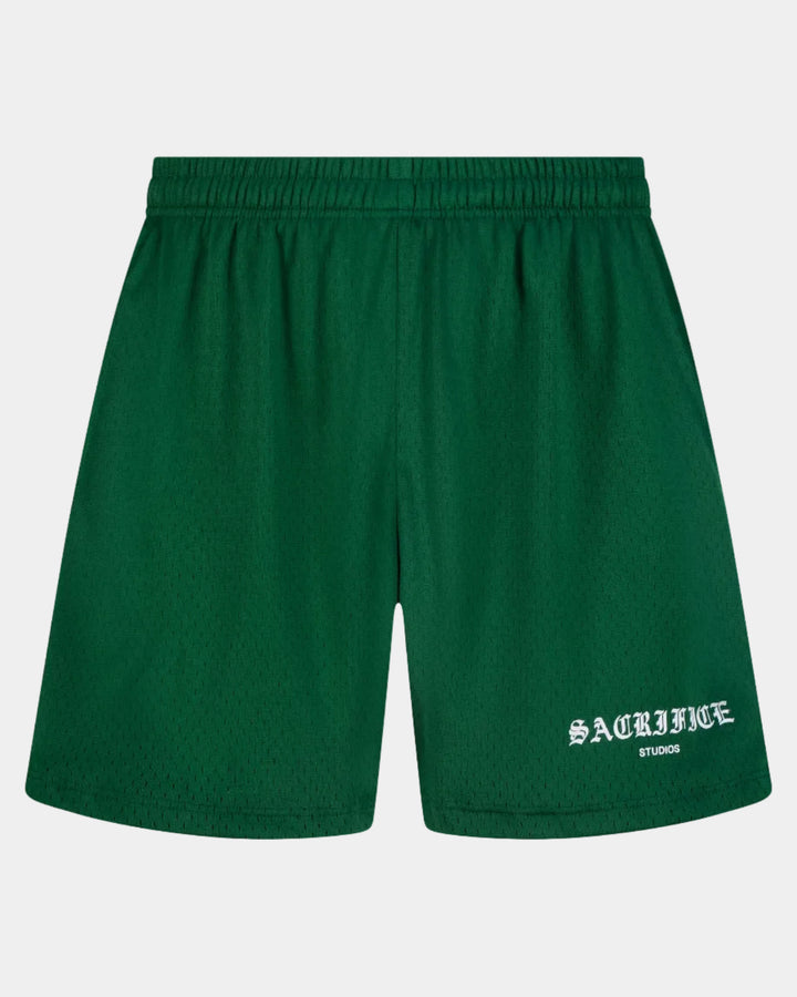 Green shorts with a brand logo on a white background