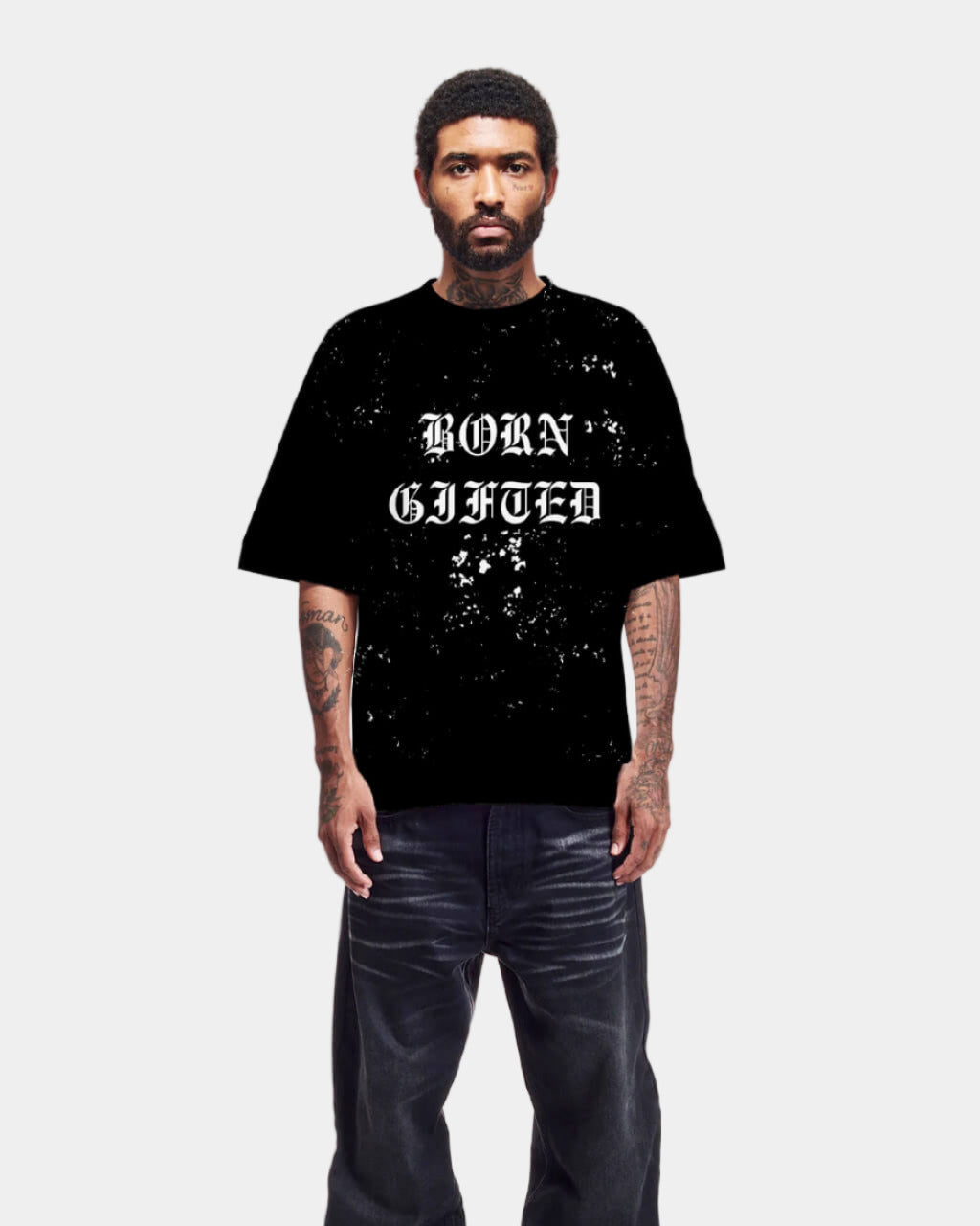 Person wearing a black t-shirt with 'BORN gifted' text on a white background