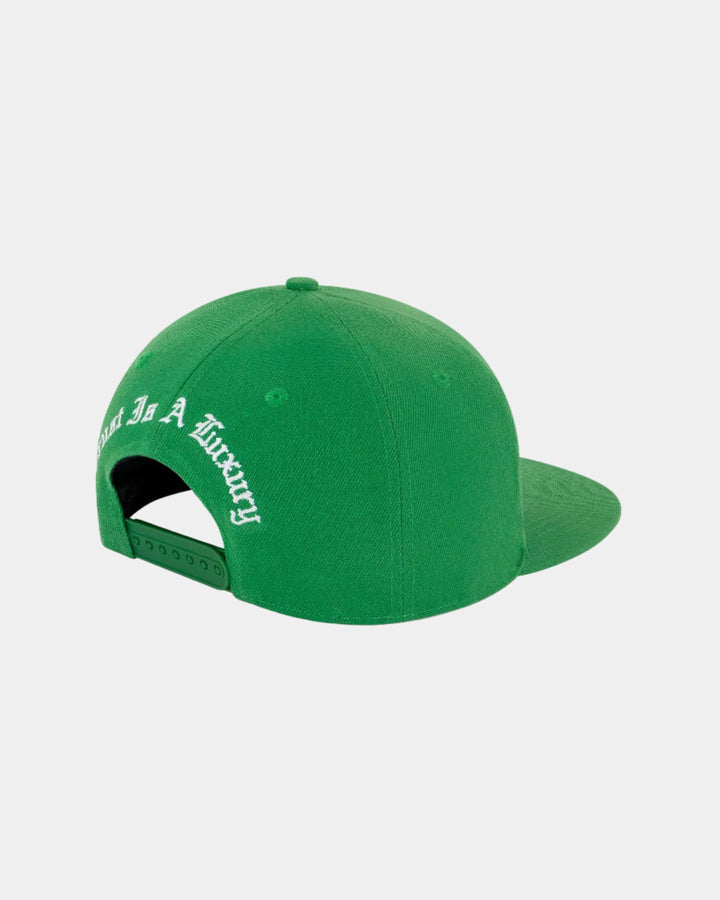Green cap with text on a white background