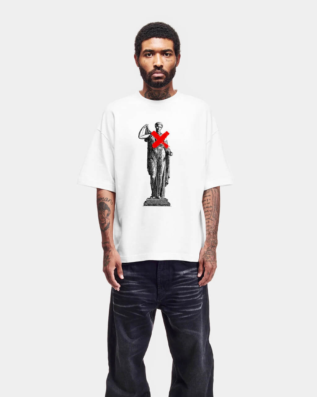 Person wearing a white t-shirt with a graphic design on a white background
