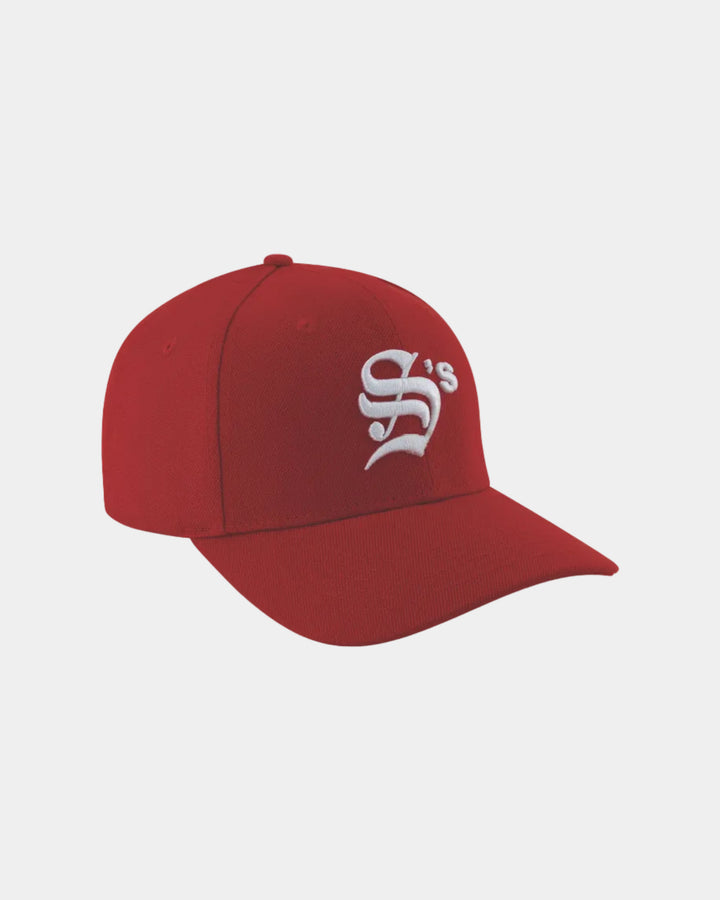 Red cap with a white logo on a grey background