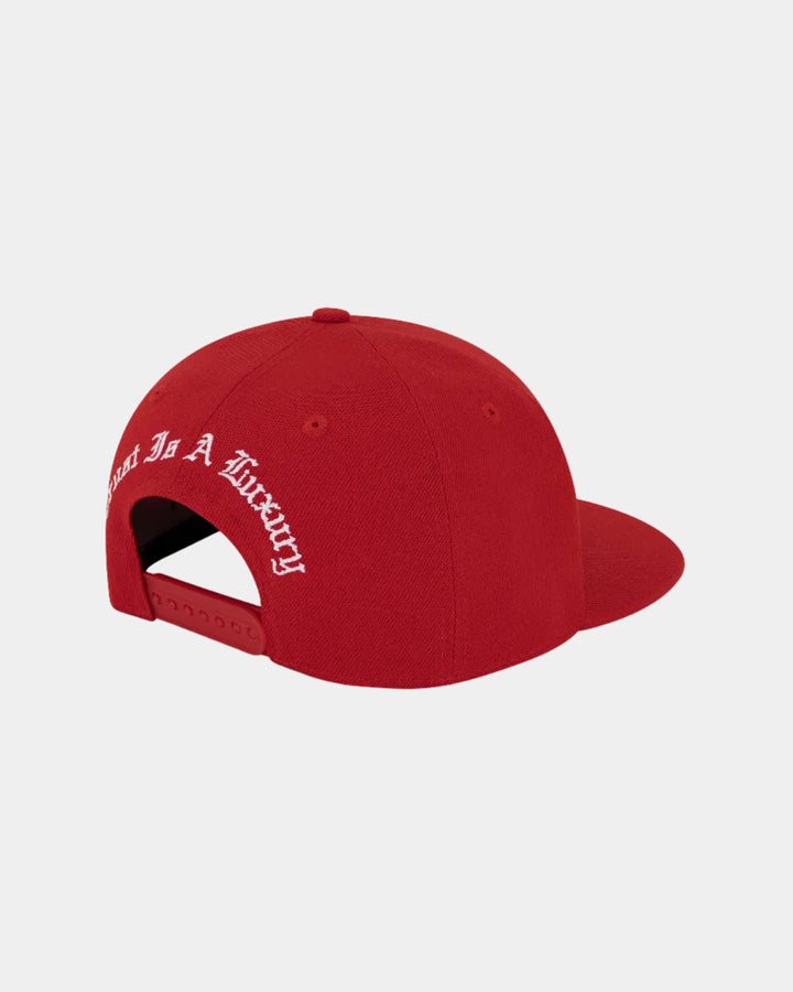 Red cap with white text on a white background